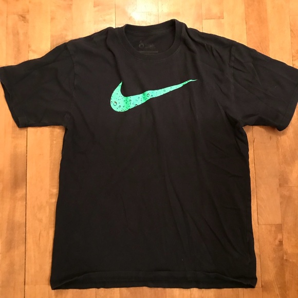 black nike shirt with green swoosh